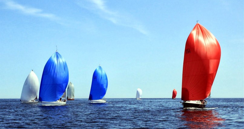 blue and red sailboat spinnakers in Championship Regatta