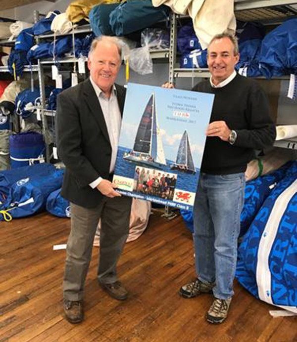Rick Williams with jack Slattery of North Sails Loft (Salem, MA) accepting CHARIAD's team winning season poster