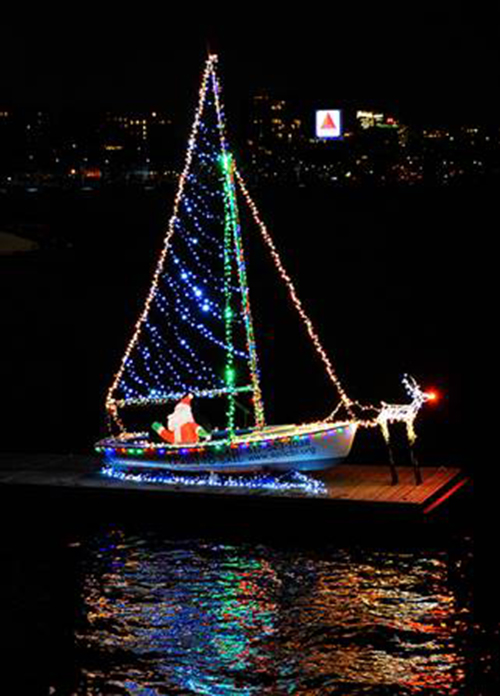 Santa in sailboat with Christmas lights