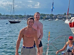 Chris and Stuart take swim off sailboat after Ted Hood Regatta