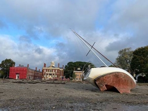 Storm damage boat on beach in Salem MA photo by Rick Williams